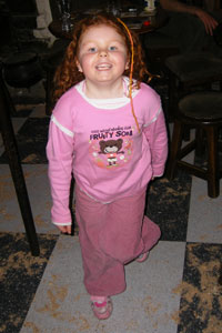 Red-headed Irish girl dancing in Sean's Bar, Athlone