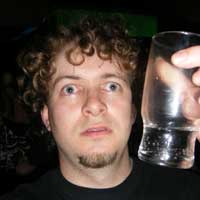 pursuit of inebriation, stage 4 wherein protagonist is pictured with vodka