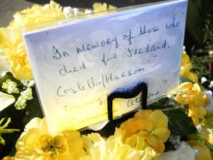 flowers left at the foot of the Athlone IRA statue reading, in memory of those who died for Irelandwith a list of five local names