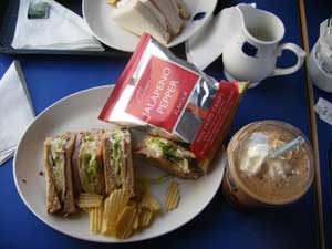 a sandwich, bag of crisps and iced mocha served at obrien's sandwich bar
