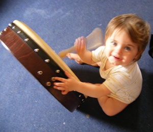 munchkin playing the bodhran