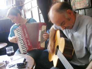 musicians gathered around the table at a traditional Irish session in Sean's Bar, Athlone
