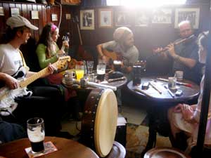 musicians gathered around the table at a traditional Irish session in Sean's Bar, Athlone