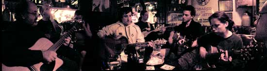musicians gathered around the table at the shack session in athlone