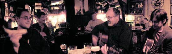 musicians gathered around the table at the shack session in athlone
